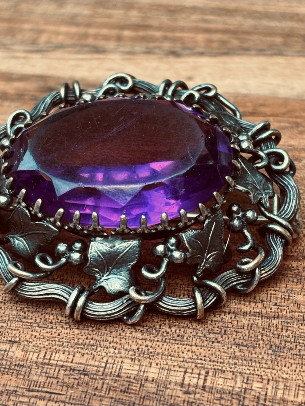 Sterling silver brooch with purple glass stone
